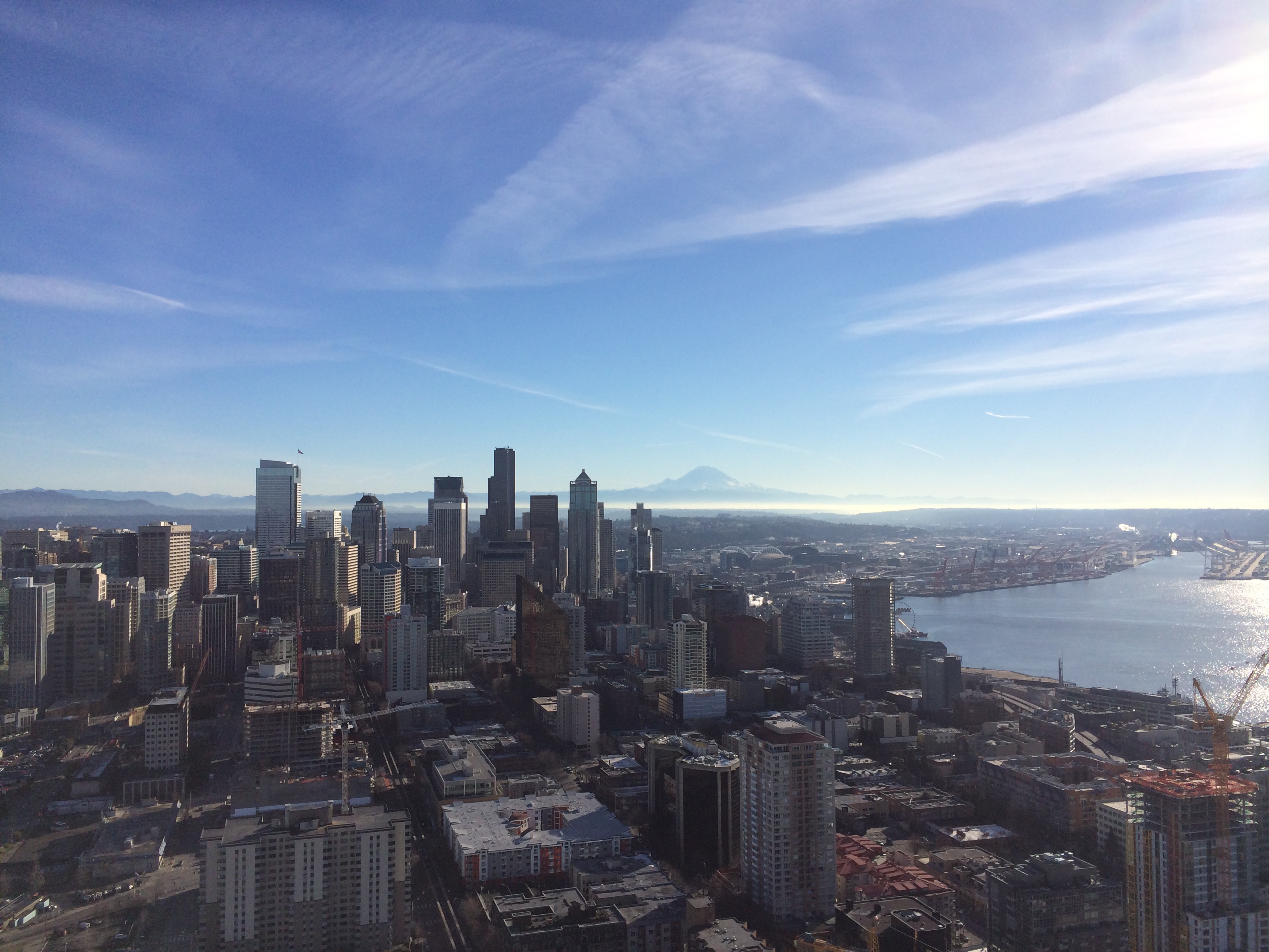 Through the glass wall.